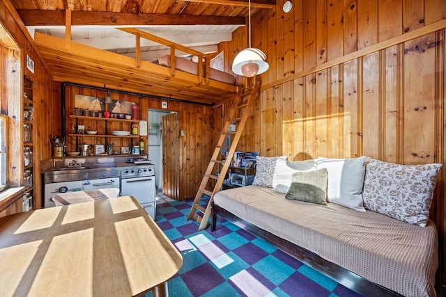 bedroom with wooden walls, tile patterned floors, lofted ceiling with beams, and wood ceiling