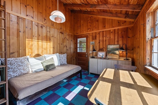 bedroom with wood walls, tile patterned floors, lofted ceiling with beams, and wooden ceiling