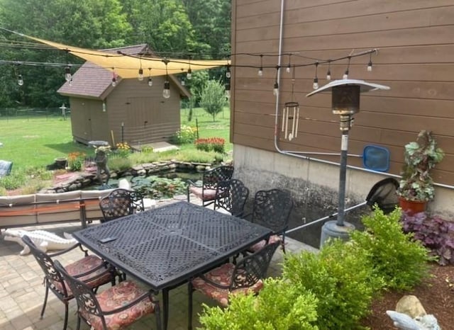1472 Pleasant St, Athol, MA 01331 - view of patio featuring outdoor dining area and an outbuilding