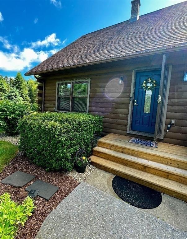 1472 Pleasant St, Athol, MA 01331 - property entrance featuring roof with shingles