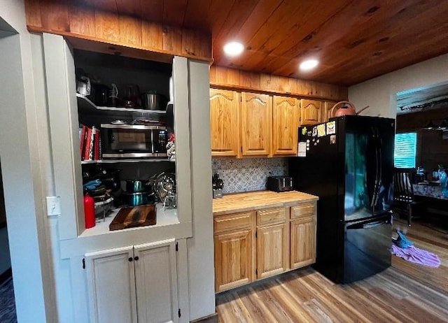 1472 Pleasant St, Athol, MA 01331 - kitchen with stainless steel microwave, freestanding refrigerator, light wood-type flooring, wooden ceiling, and decorative backsplash