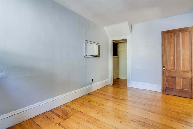 spare room featuring light wood-type flooring