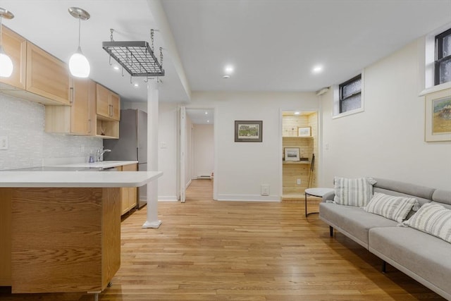 living room with light hardwood / wood-style floors