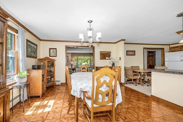 4 Pleasantview Ave, Tyngsborough, MA 01879 - dining room featuring a chandelier, healthy amount of natural light, a baseboard heating unit, and ornamental molding