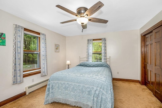 4 Pleasantview Ave, Tyngsborough, MA 01879 - carpeted bedroom featuring a baseboard radiator, baseboards, a closet, and a ceiling fan