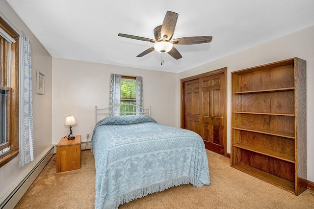 4 Pleasantview Ave, Tyngsborough, MA 01879 - bedroom with baseboard heating, light colored carpet, a closet, and ceiling fan