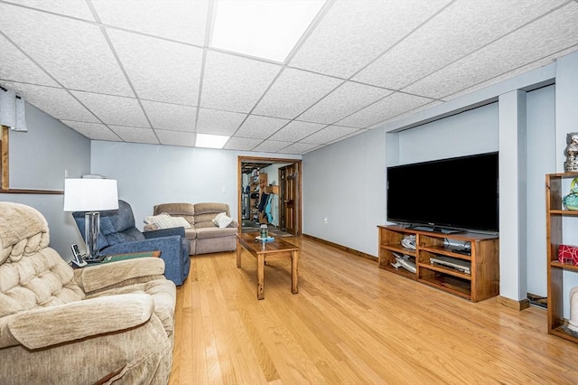 4 Pleasantview Ave, Tyngsborough, MA 01879 - living area with light wood finished floors, a paneled ceiling, and baseboards