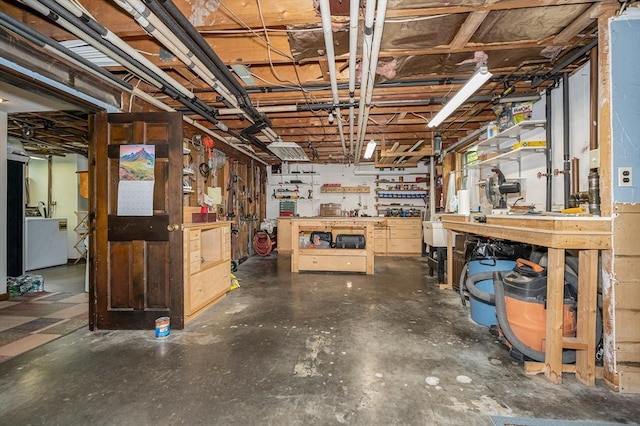 4 Pleasantview Ave, Tyngsborough, MA 01879 - basement featuring a workshop area and washer / clothes dryer