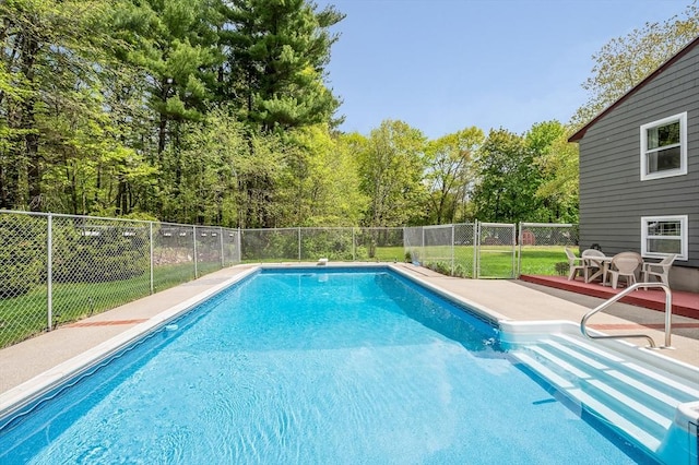 4 Pleasantview Ave, Tyngsborough, MA 01879 - view of pool featuring fence, a patio area, and view of wooded area