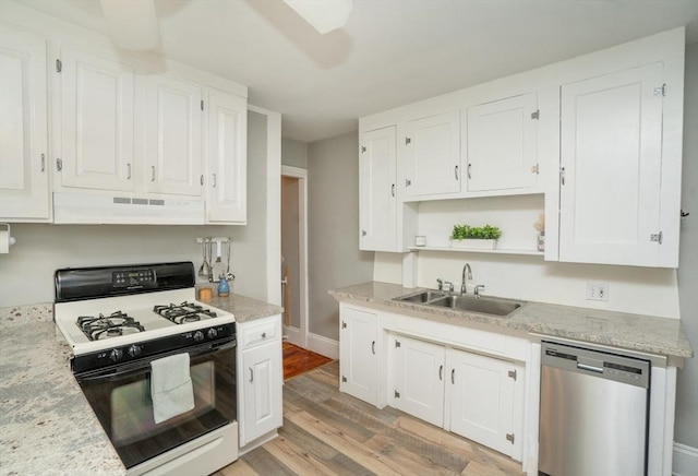 kitchen with gas stove, under cabinet range hood, dishwasher, a sink, and white cabinetry