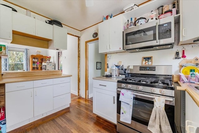 1241 Riverside Ave, Somerset, MA 02726 - kitchen featuring baseboards, white cabinetry, dark wood-type flooring, light countertops, and appliances with stainless steel finishes