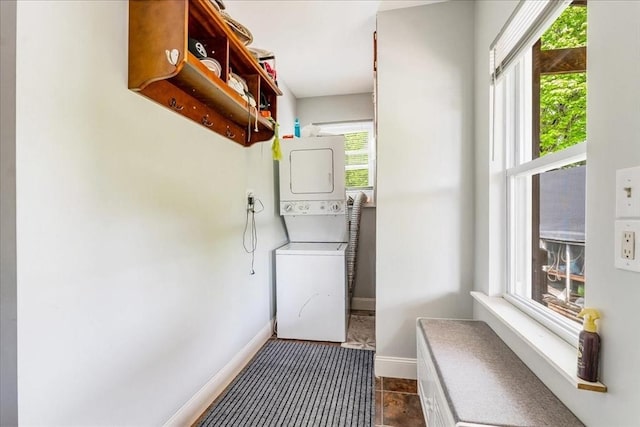 1241 Riverside Ave, Somerset, MA 02726 - washroom with laundry area, baseboards, and stacked washer and dryer