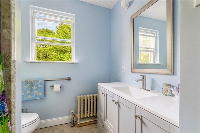 1241 Riverside Ave, Somerset, MA 02726 - full bathroom with radiator, toilet, baseboards, and vanity