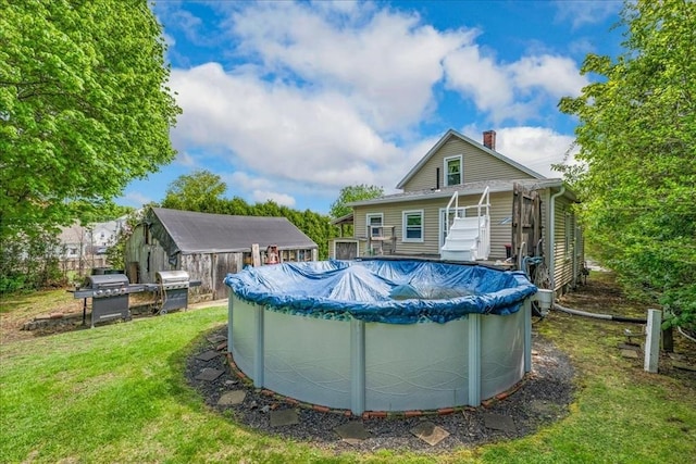 1241 Riverside Ave, Somerset, MA 02726 - rear view of property featuring a covered pool, a chimney, and a lawn