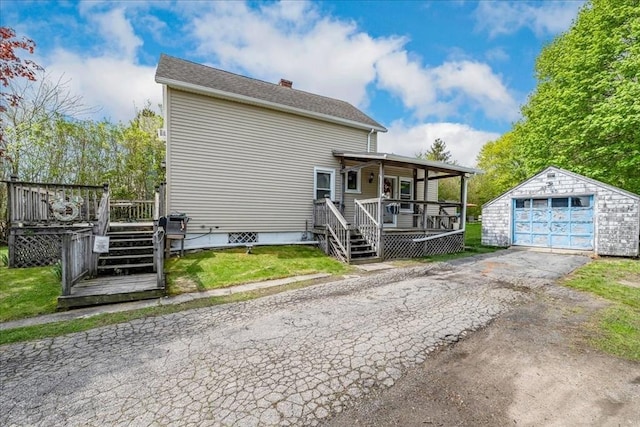 1241 Riverside Ave, Somerset, MA 02726 - exterior space with a chimney, driveway, an outbuilding, covered porch, and a garage
