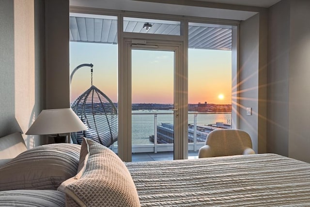 bedroom featuring a water view