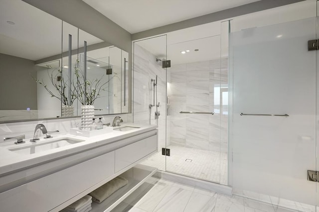 bathroom featuring an enclosed shower and vanity