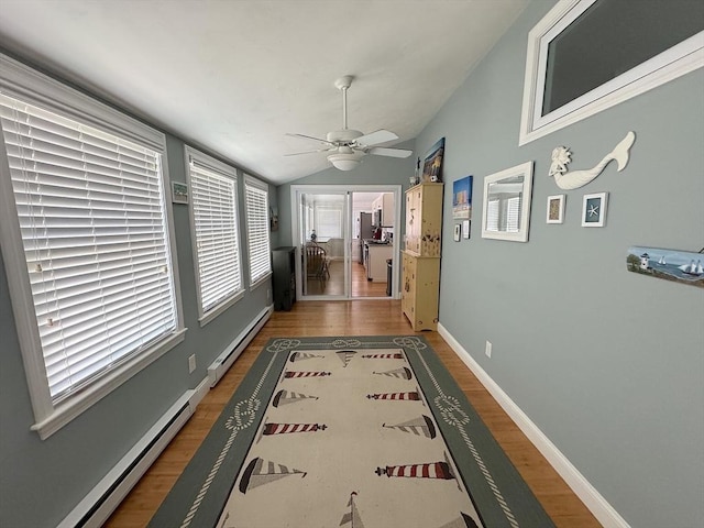 15 Wales Dr, Bourne, MA 02559 - corridor with baseboard heating, wood finished floors, a baseboard heating unit, and lofted ceiling