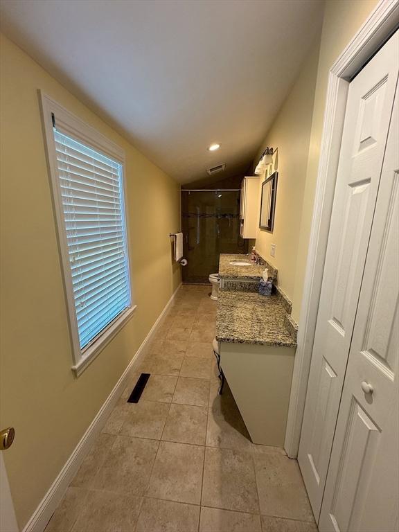 15 Wales Dr, Bourne, MA 02559 - hall featuring light tile patterned floors, vaulted ceiling, and recessed lighting
