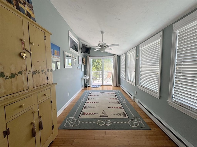 15 Wales Dr, Bourne, MA 02559 - hallway with light wood-style flooring, a baseboard heating unit, and lofted ceiling