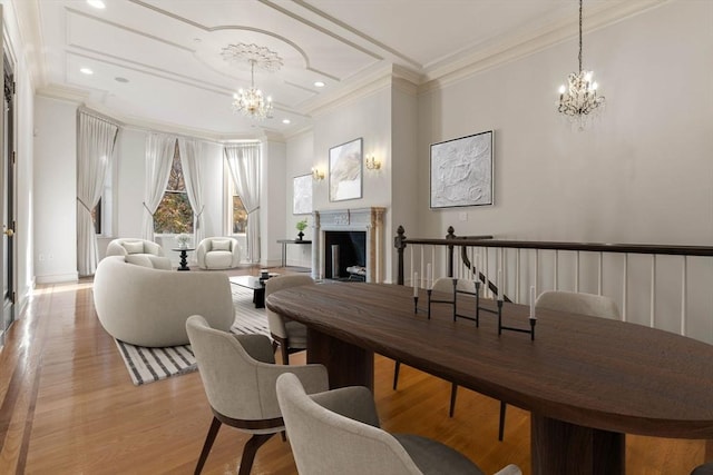 living room with crown molding and light hardwood / wood-style flooring