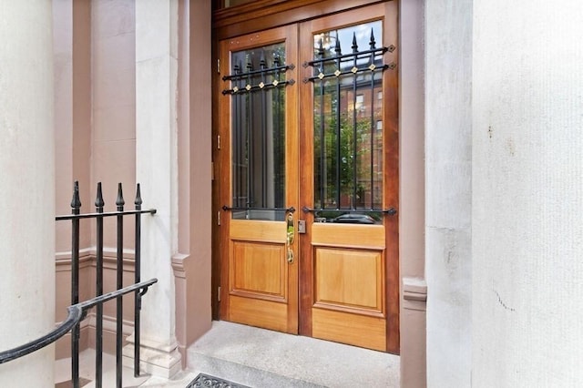 property entrance featuring french doors