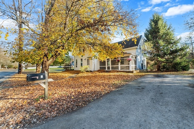 view of front of property featuring a sunroom