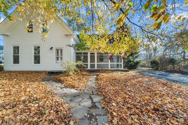 back of property featuring a sunroom