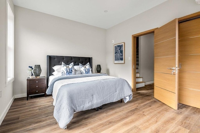 bedroom with hardwood / wood-style floors