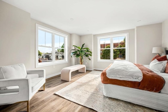 bedroom with light wood-type flooring