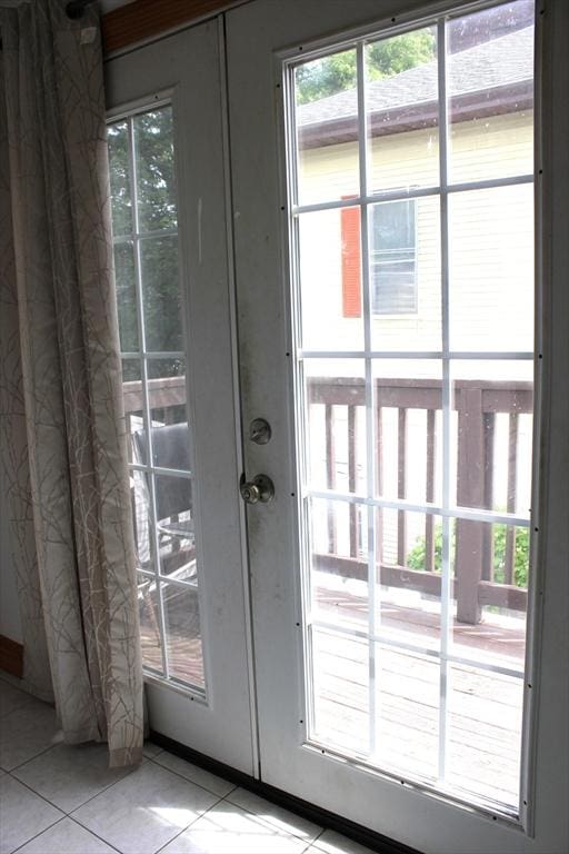 143 Branch St, Lowell, MA 01851 - doorway with tile patterned floors and healthy amount of natural light