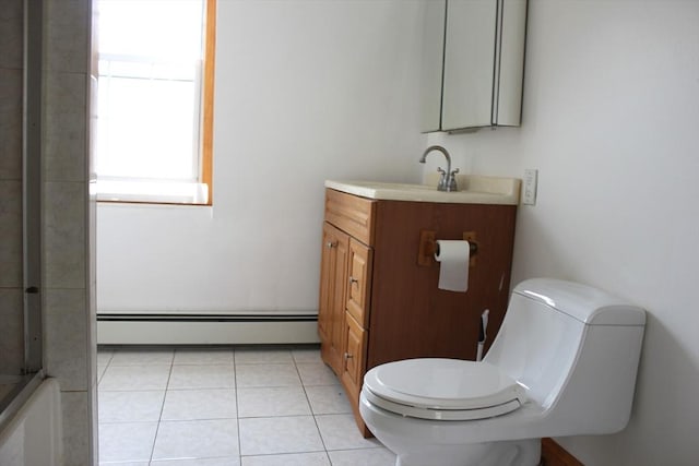 143 Branch St, Lowell, MA 01851 - bathroom with a baseboard radiator, toilet, vanity, a shower, and tile patterned flooring