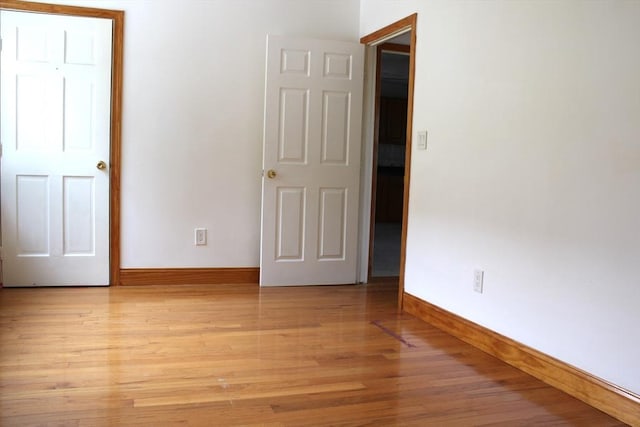 143 Branch St, Lowell, MA 01851 - unfurnished bedroom featuring baseboards and light wood finished floors