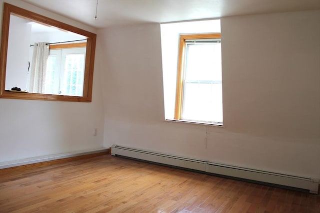 143 Branch St, Lowell, MA 01851 - empty room featuring a baseboard radiator and light wood-type flooring