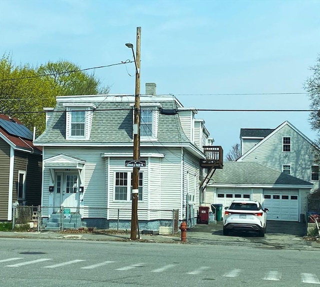 143 Branch St, Lowell, MA 01851 - second empire-style home with mansard roof, roof with shingles, a fenced front yard, and a chimney