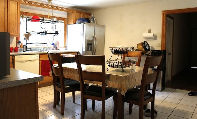 143 Branch St, Lowell, MA 01851 - dining area featuring light tile patterned flooring