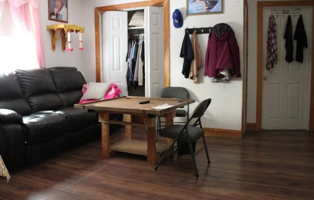 143 Branch St, Lowell, MA 01851 - living room with dark wood-style flooring and baseboards