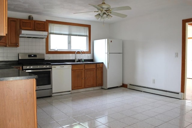143 Branch St, Lowell, MA 01851 - kitchen featuring white appliances, a baseboard radiator, range hood, a sink, and dark countertops