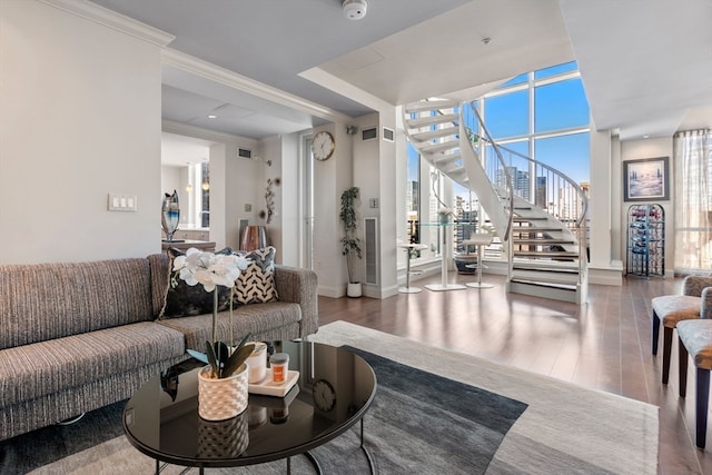 living room featuring hardwood / wood-style flooring, floor to ceiling windows, and ornamental molding