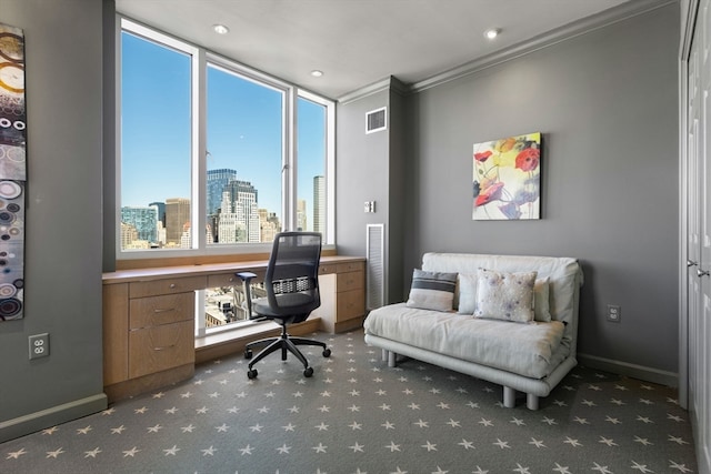 carpeted office with crown molding