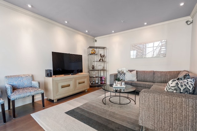 living room with dark hardwood / wood-style flooring and crown molding