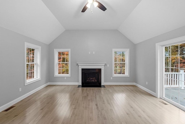 unfurnished living room featuring lofted ceiling, light hardwood / wood-style floors, and ceiling fan