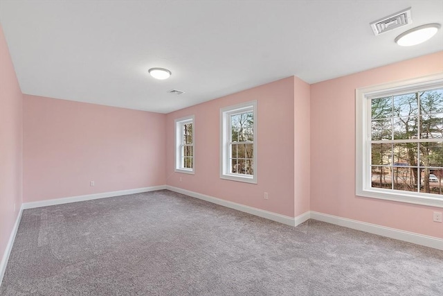 unfurnished room featuring carpet