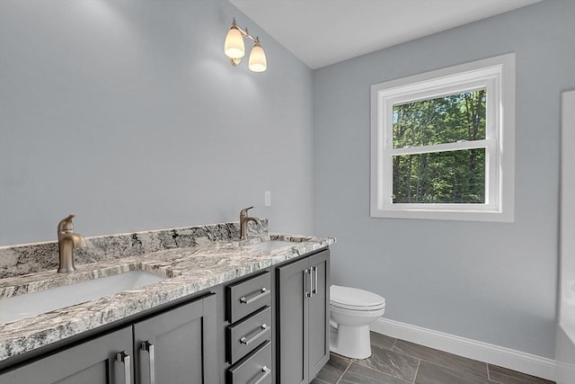 bathroom with vanity and toilet