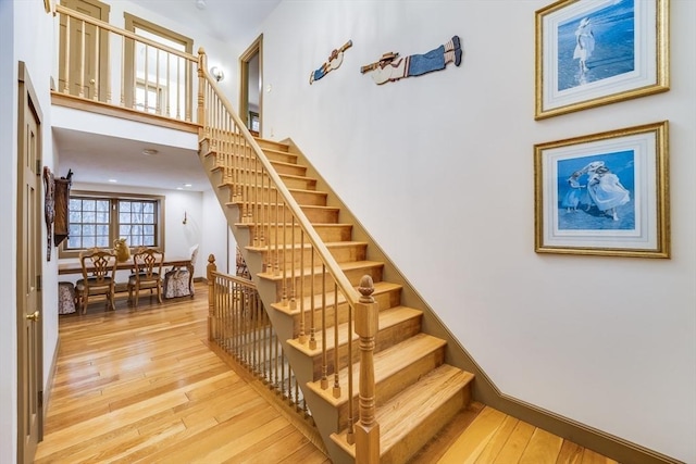 stairway featuring wood-type flooring