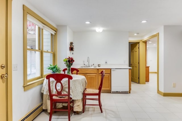 dining area featuring baseboards, a baseboard heating unit, and recessed lighting