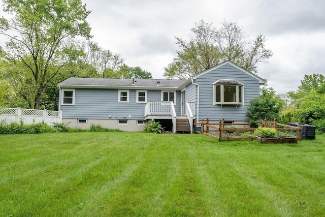 34 Brooks Rd, Wayland, MA 01778 - rear view of property featuring a deck and a garden
