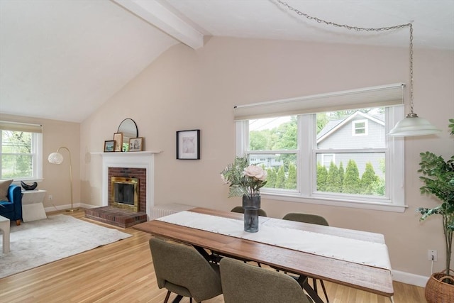 34 Brooks Rd, Wayland, MA 01778 - dining space featuring light wood-style flooring, a brick fireplace, and baseboards