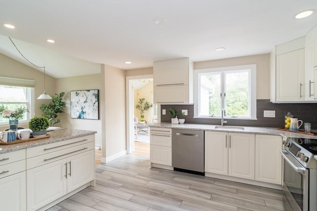 34 Brooks Rd, Wayland, MA 01778 - kitchen featuring stainless steel appliances, a sink, plenty of natural light, light wood-type flooring, and recessed lighting