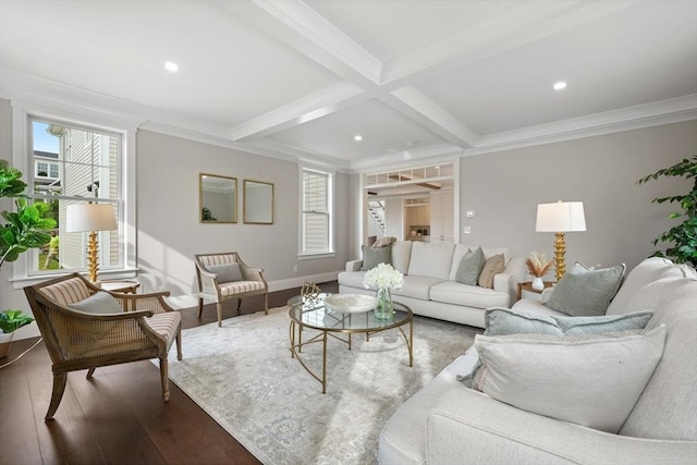 living room with plenty of natural light, crown molding, beamed ceiling, and wood finished floors